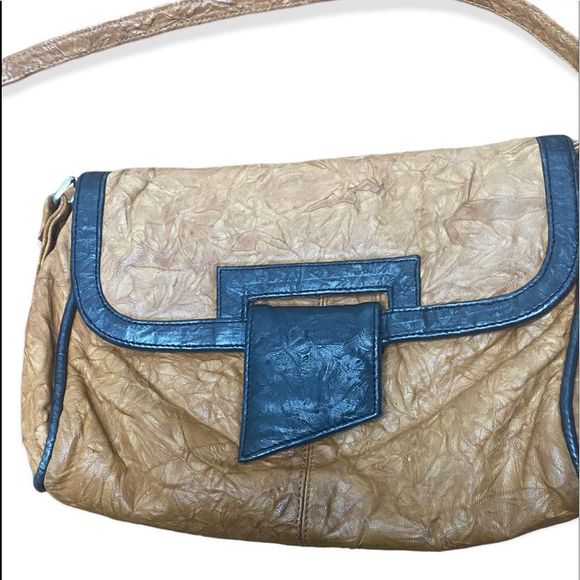 Handbags - Zimbabwe brown leather crossbody with black trim snap closure two zip pockets